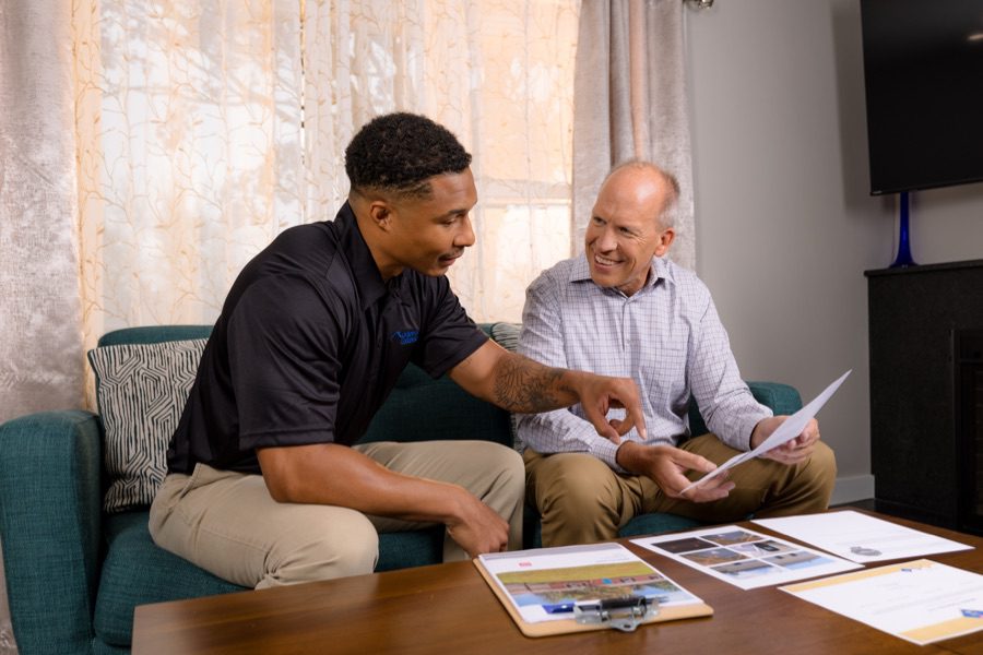 roofing expert consulting with client